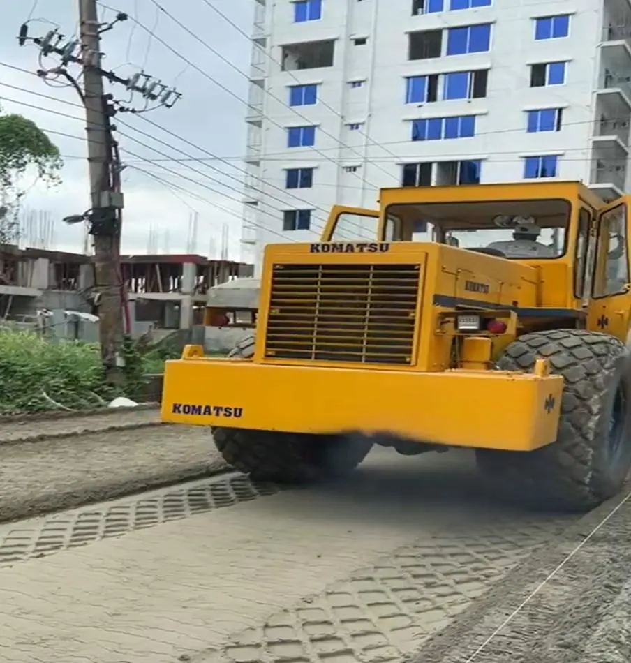 Day 2 — pneumatic tyre roller sealing the base.
