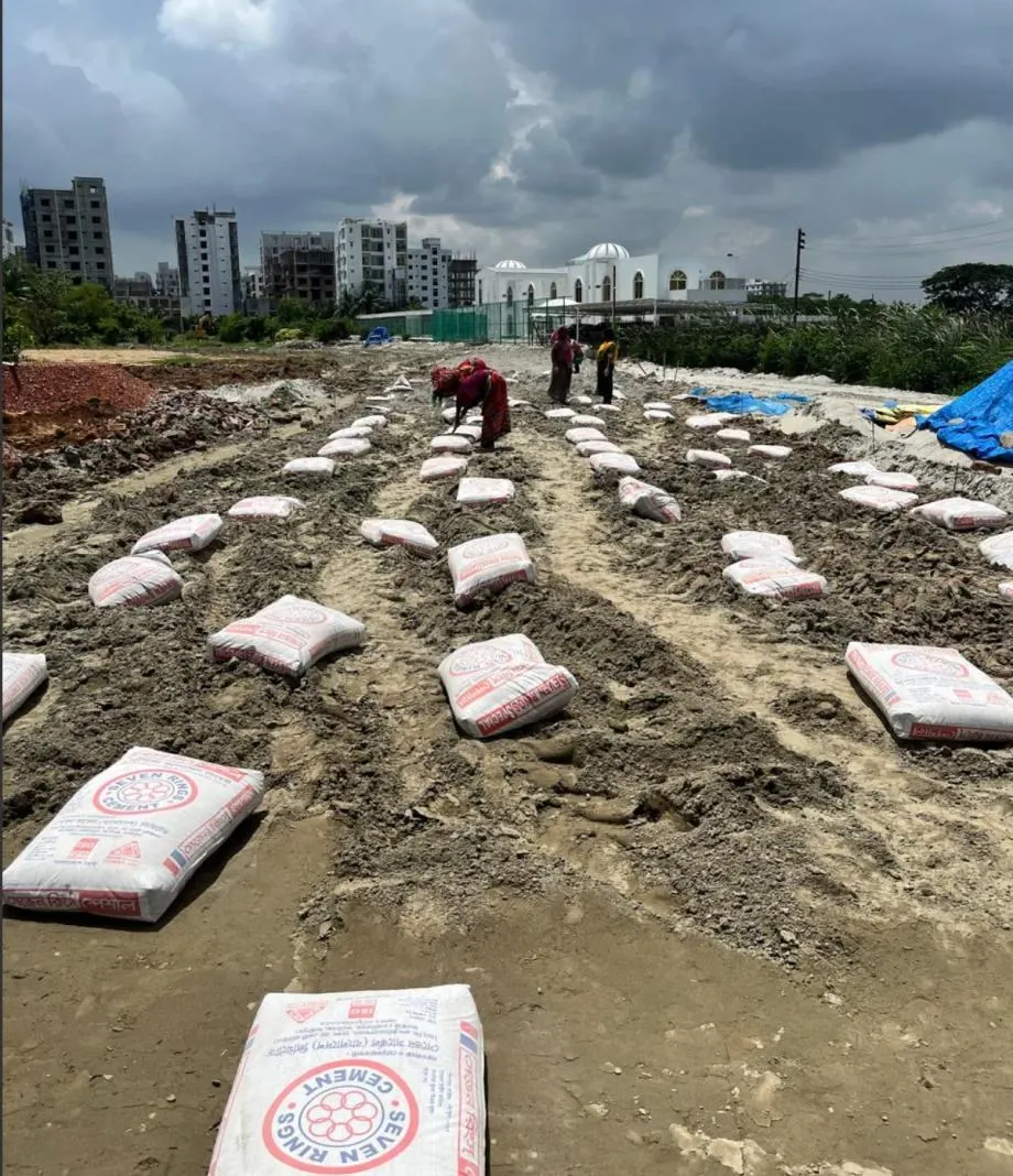 Day 1 — cement bags set out on a measured grid.
