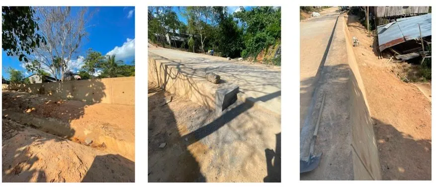 The road carried on top of the retaining wall.