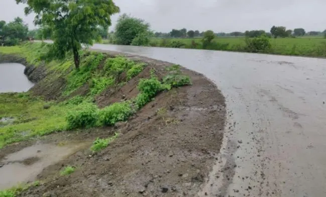 The same alignment after SoilBinder stabilization — a firm, smooth surface shedding rainwater.